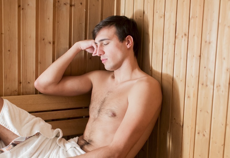 Man feeling bad in an infrared sauna
